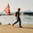 Matt walking by Swiss flag