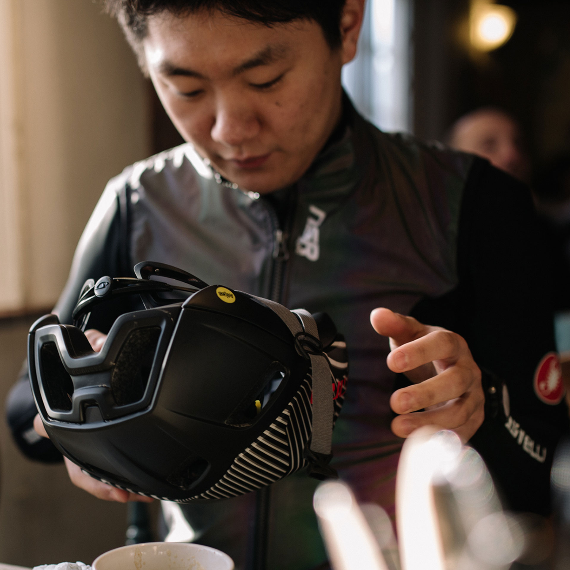 Cyclist fitting a helmet