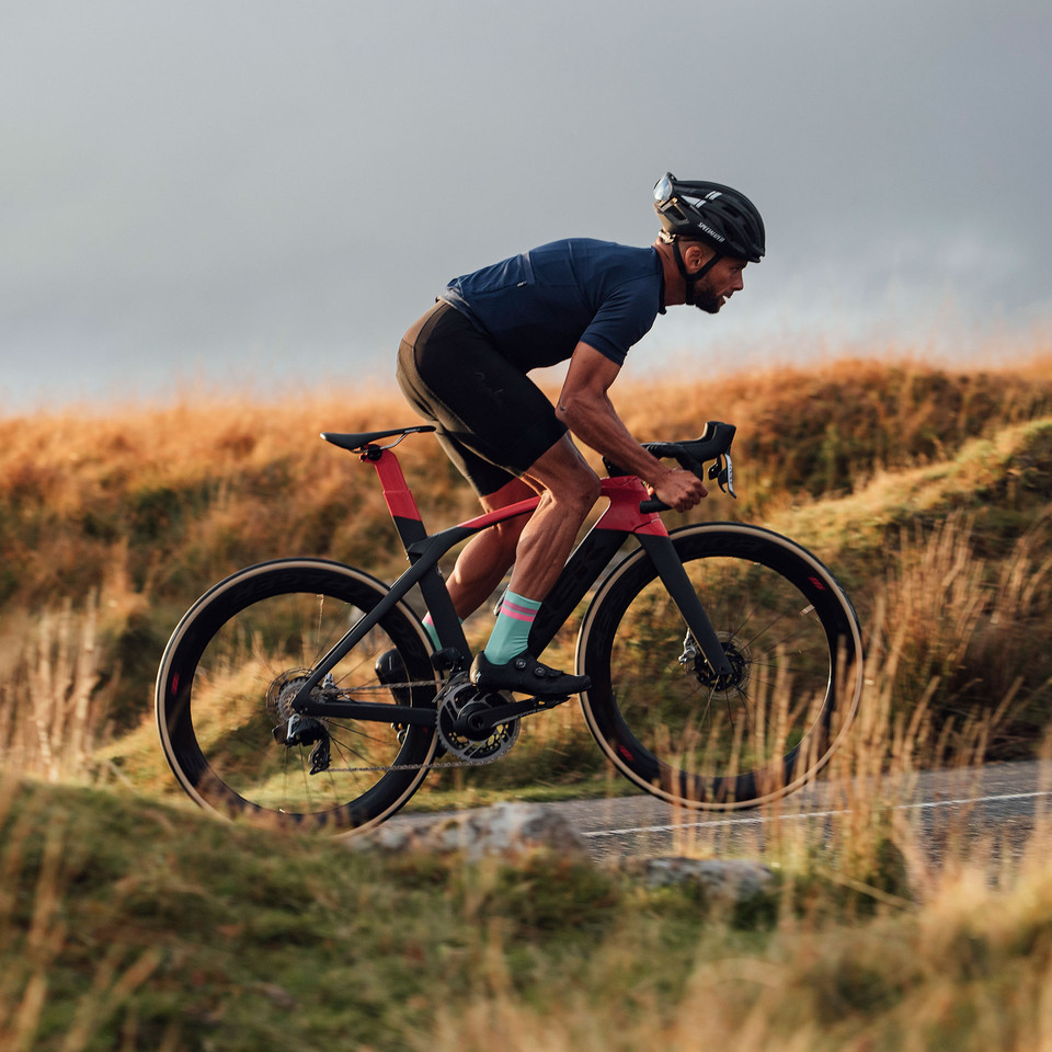 Cyclist on Trek Madone Road Bike Riding With SRAM RED eTap AXS Groupset