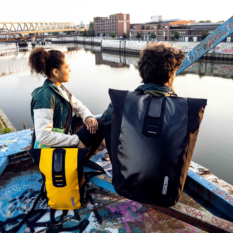 Two people wearing Ortlieb Backpacks