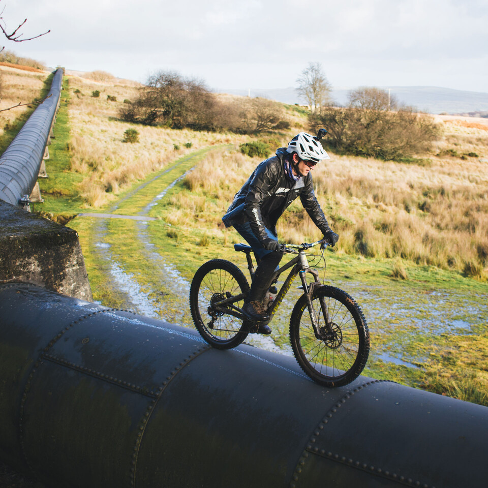 Tom Shopland Riding along a pipe